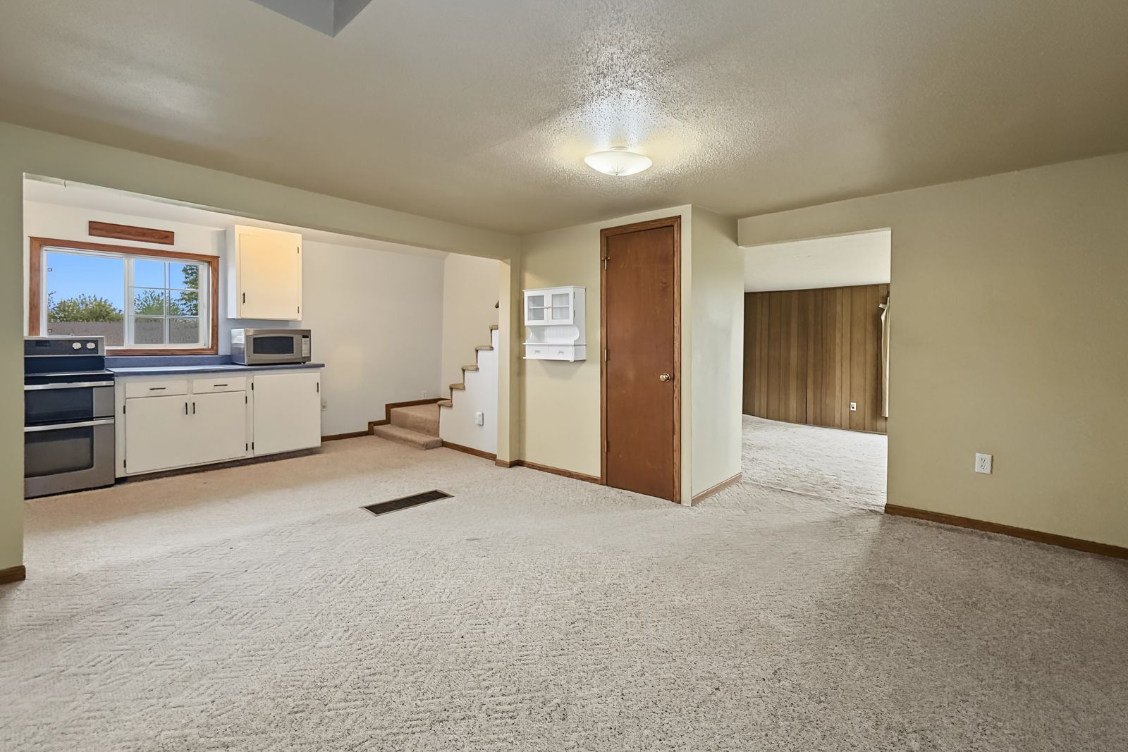 260 County Line Rd, Runnells — Dining area opening to the kitchen and stairs