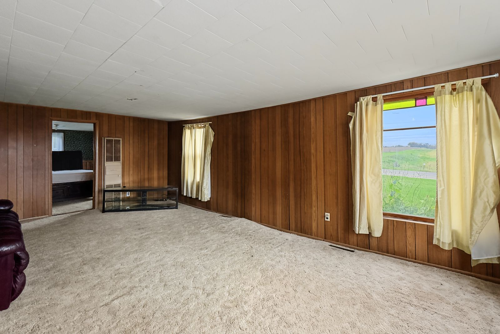 260 County Line Rd, Runnells — Living room windows looking out to the land