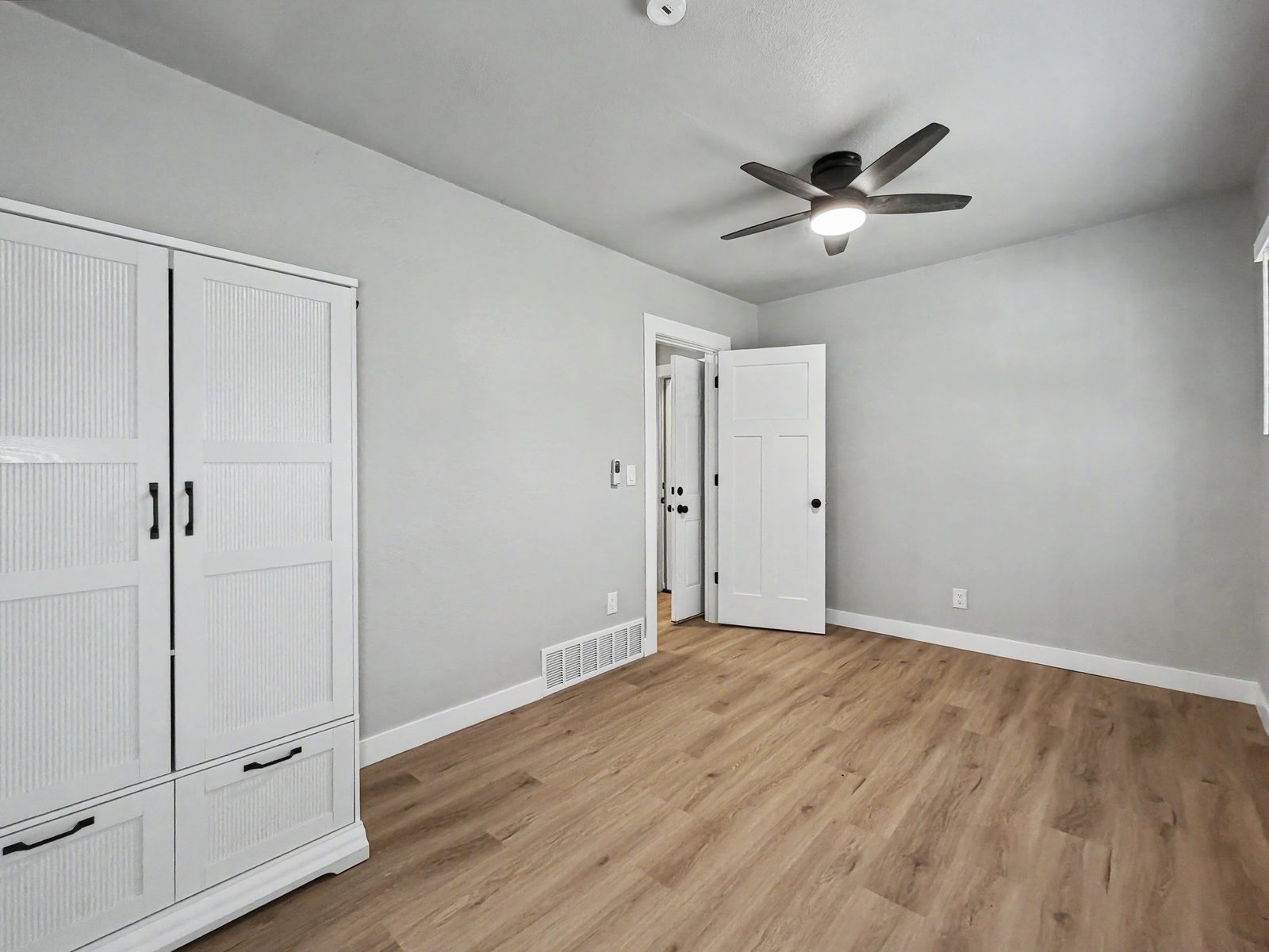 Bedroom with LVP flooring and built-in closet at 3436 Scott Ave Des Moines Iowa
