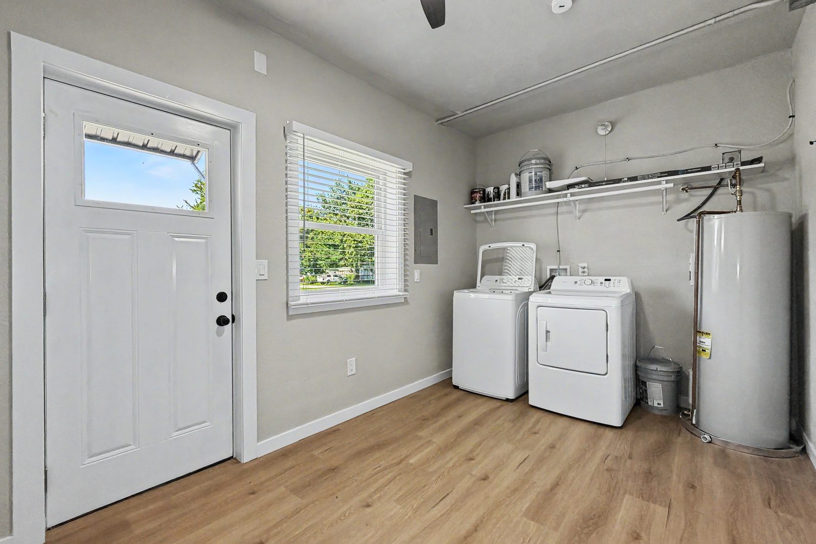 Laundry room with washer dryer and water heater at 3436 Scott Ave northeast Des Moines
