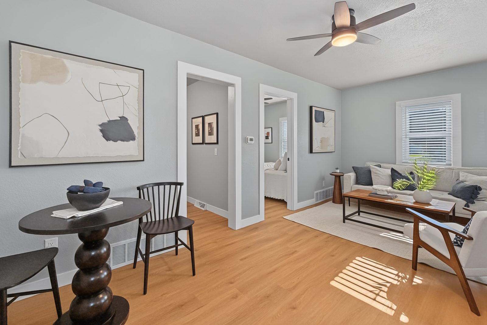 Dining nook and open living area looking through to the bedrooms at 3436 Scott Ave Des Moines